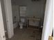 Unfinished bathroom with toilet, bathtub, and a simple vanity at 37909 W Raymond St, Tonopah, AZ 85354