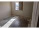 Unfinished bedroom with concrete floors and a single window at 37909 W Raymond St, Tonopah, AZ 85354