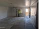 Unfinished living room with ceiling fan and access to patio at 37909 W Raymond St, Tonopah, AZ 85354