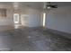 Unfinished living room with open floor plan and kitchen access at 37909 W Raymond St, Tonopah, AZ 85354