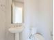 Simple bathroom with pedestal sink and toilet at 17640 W Guthrie St, Surprise, AZ 85388