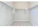 Large walk-in closet with ample shelving and hanging rods at 17640 W Guthrie St, Surprise, AZ 85388