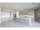 Modern kitchen with gray cabinets, white quartz countertops, and stainless steel appliances at 17640 W Guthrie St, Surprise, AZ 85388