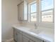 Bright laundry room with modern cabinets and quartz countertop at 17640 W Guthrie St, Surprise, AZ 85388