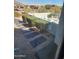 Stylish patio with desert landscape and modern furniture for relaxing and enjoying the outdoors at 18475 W Eagle Dr, Goodyear, AZ 85338