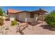 Charming back yard with a covered patio and tranquil desert landscaping at 542 S Higley Rd # 99, Mesa, AZ 85206