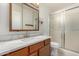 Updated bathroom with wood cabinet, modern sink and shower/tub combo offers a clean and functional space at 542 S Higley Rd # 99, Mesa, AZ 85206