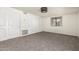 Cozy bedroom featuring neutral carpet, ample closet space, and a window with a view at 542 S Higley Rd # 99, Mesa, AZ 85206