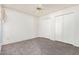 Neutral bedroom featuring carpet, dual closets, and ceiling fan for a comfortable and serene atmosphere at 542 S Higley Rd # 99, Mesa, AZ 85206