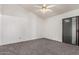 Bedroom features carpet, vaulted ceiling, sliding glass door with natural light, and neutral paint for comfort at 542 S Higley Rd # 99, Mesa, AZ 85206