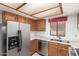 Bright kitchen featuring stainless steel appliances, quartz countertops, and wood cabinets at 542 S Higley Rd # 99, Mesa, AZ 85206