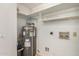 Water heater and storage in utility room, offering functional space for home systems and additional storage needs at 542 S Higley Rd # 99, Mesa, AZ 85206