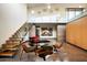 Mid-century modern sitting area with floating staircase and glass railings at 5555 N Camino Del Contento --, Paradise Valley, AZ 85253