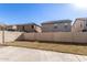 Large backyard with block fencing, offering privacy and space for outdoor enjoyment at 8913 E Oro Cir, Mesa, AZ 85212