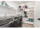 Spacious laundry room features shelving and Samsung washer and dryer at 8913 E Oro Cir, Mesa, AZ 85212