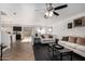 Bright living room with hardwood floors and neutral-toned furniture, open floor plan at 8913 E Oro Cir, Mesa, AZ 85212
