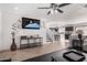 Open floor plan living room featuring adjacent kitchen, neutral walls, and hard floors at 8913 E Oro Cir, Mesa, AZ 85212