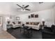 Bright living room featuring hardwood floors, neutral-toned furniture, and ample natural light at 8913 E Oro Cir, Mesa, AZ 85212