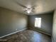 Well-lit bedroom featuring tile flooring and ceiling fan at 2007 N 67Th Dr, Phoenix, AZ 85035