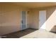 A covered patio is an inviting outdoor space featuring secure doors and ample natural light at 2007 N 67Th Dr, Phoenix, AZ 85035