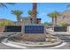 Community entrance sign at Ascent at the Phoenician with lush landscaping and contemporary design elements at 5000 E Camelback Ridge Rd # 204, Scottsdale, AZ 85251