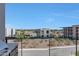 Balcony view overlooking neighboring home exteriors and the clear, blue sky above at 5000 E Camelback Ridge Rd # 204, Scottsdale, AZ 85251