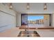 Modern kitchen features stainless steel sink, faucet and countertops, and a wood extension to the kitchen island at 5000 E Camelback Ridge Rd # 204, Scottsdale, AZ 85251