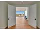 Living area entryway boasting beautiful hardwood floors and bright light, with an opening to the outdoors at 5000 E Camelback Ridge Rd # 204, Scottsdale, AZ 85251