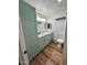 Well-lit bathroom with mint-colored cabinetry, granite countertops, and updated fixtures at 8241 N Central Ave # 24, Phoenix, AZ 85020