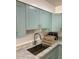 A close up shot of the kitchen sink featuring a modern faucet and ample counter space at 8241 N Central Ave # 24, Phoenix, AZ 85020