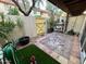 Private patio with a yellow gate, potted plants, and brick pavers at 8241 N Central Ave # 24, Phoenix, AZ 85020