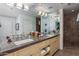 Modern bathroom with double vanity and granite countertop at 9177 E Sunflower Ct, Scottsdale, AZ 85266