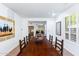 Spacious dining room with a large wooden table and seating at 9177 E Sunflower Ct, Scottsdale, AZ 85266