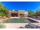 Stunning pool area with lounge chairs and patio furniture at 9177 E Sunflower Ct, Scottsdale, AZ 85266