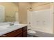 Bathroom with a single sink vanity, and a shower over bath at 10065 E Thatcher Ave, Mesa, AZ 85212