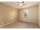 Bedroom featuring a ceiling fan and a window with shutters at 10065 E Thatcher Ave, Mesa, AZ 85212