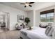 Inviting primary bedroom offering a seating area, contemporary decor, and ample natural light at 10065 E Thatcher Ave, Mesa, AZ 85212