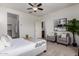 Comfortable primary bedroom with seating area, stylish decor, and neutral tones for relaxation at 10065 E Thatcher Ave, Mesa, AZ 85212