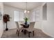 Intimate dining area features a round table with neutral chairs, creating a cozy and inviting atmosphere at 10065 E Thatcher Ave, Mesa, AZ 85212