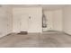 Spacious garage with a water heater, door to outside, and garage door at 10065 E Thatcher Ave, Mesa, AZ 85212