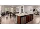 Stylish kitchen with granite island, stainless appliances, open layout to living and dining spaces at 10065 E Thatcher Ave, Mesa, AZ 85212