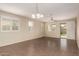 Bright, open living area with tile floors, neutral walls, and plentiful natural light at 10065 E Thatcher Ave, Mesa, AZ 85212