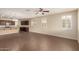 Expansive living space featuring a kitchen bar, dark cabinetry and tile flooring at 10065 E Thatcher Ave, Mesa, AZ 85212