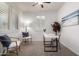 Bright home office featuring natural light, modern desk, and comfortable seating for productive work at 10065 E Thatcher Ave, Mesa, AZ 85212