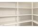 Walk-in pantry features white shelving for maximum storage at 10065 E Thatcher Ave, Mesa, AZ 85212