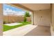 Covered patio area with stucco and an outdoor view of the landscaped backyard at 10065 E Thatcher Ave, Mesa, AZ 85212