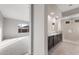 Bathroom with double vanity, large shower, and modern fixtures at 22531 E Orchard Ln, Queen Creek, AZ 85142