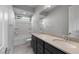 Elegant bathroom with double vanity and soaking tub at 22531 E Orchard Ln, Queen Creek, AZ 85142