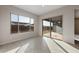 Bright dining area with sliding glass door to backyard at 22531 E Orchard Ln, Queen Creek, AZ 85142