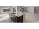 Modern kitchen island with dark cabinetry and granite countertops at 22531 E Orchard Ln, Queen Creek, AZ 85142